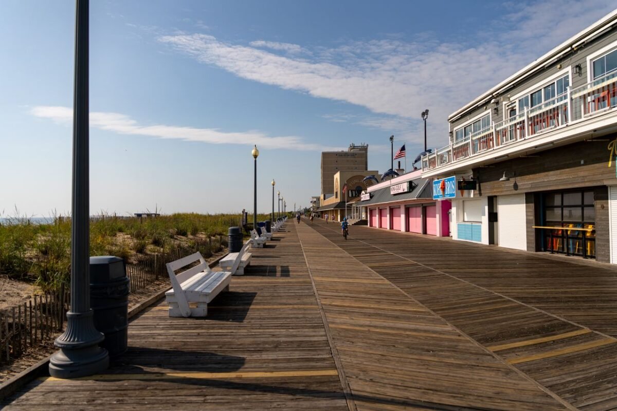 A sunny day on the famous Rehoboth Beach boardwalk in Delaware, capturing serenity and architecture.